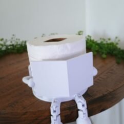 Suporte para papel higiênico leitor com perninhas articuladas decorativo banheiro
